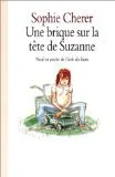 Une brique sur la tête de Suzanne